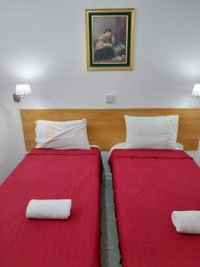 Ένα ή περισσότερα κρεβάτια σε δωμάτιο στο Whitestar Guesthouse