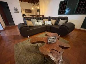 a living room with a couch and a coffee table at La jjodita- Cabaña campestre in San Gil +28 photos