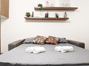 A bed or beds in a room at Verona Holidays DOC