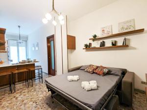 A bed or beds in a room at Verona Holidays DOC