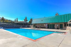 a swimming pool in front of a building at Spacious Lakeview Heavenly Mountain Escape! in Stateline