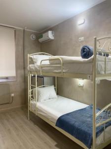 a bunk bed room with two bunk beds at Hostel GARDEN St in Odesa
