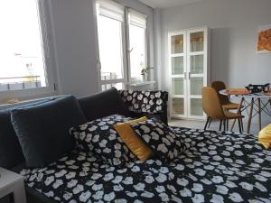 a living room with a couch and a table at Bursztynowy Apartament in Tarnowskie Góry