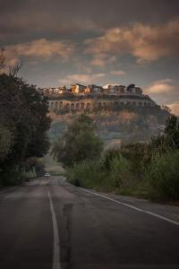 a car driving down a road on a hill at Relais Borgo sul Mare Ospitalità diffusa in Silvi Paese