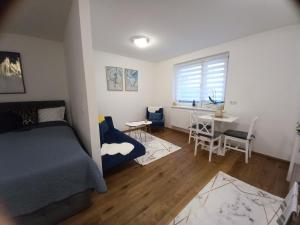 Posteľ alebo postele v izbe v ubytovaní Lauro Apartment