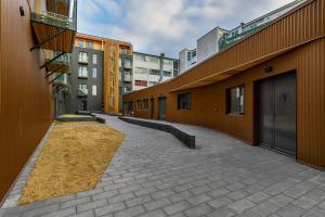 an empty alley in a city with buildings at Iceland SJF Apartments - 401 in Reykjavík
