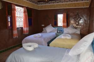 Kasbah Assafar客房内的一张或多张床位