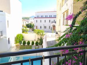 a view of the courtyard from the balcony of a building at Sea Front Studios Old Town in Rethymno Town