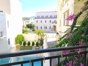 a view of the courtyard from the balcony of a building at Sea Front Studios Old Town in Rethymno