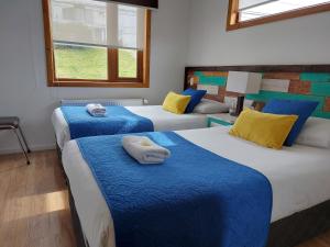 Postel nebo postele na pokoji v ubytování Hostal Buenavista Patagonia