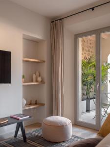 TV a/nebo společenská místnost v ubytování Can Verí Suites