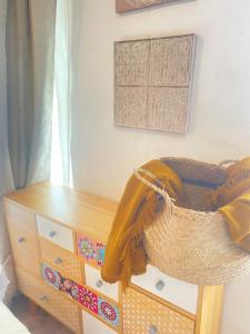 a bedroom with a dresser and a dresser with a blanket on it at Vivienda Vacacional Trespandiu in Oceño