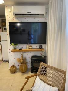 a living room with a large flat screen tv on a wall at לופט משגע במיקום מרכזי ברמת גן in Ramat Gan
