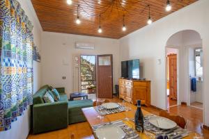 a living room with a table and a couch at Casa la noce Positano in Positano