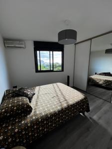 A bed or beds in a room at Nouveauté Sunset appart vue exceptionelle