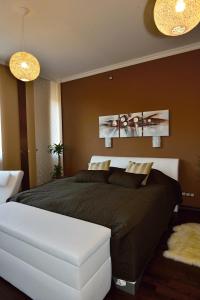 A bed or beds in a room at Angel's Apartment
