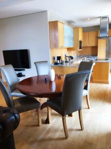 a dining room table and chairs in a kitchen at Michelangelo Towers 718 in Johannesburg