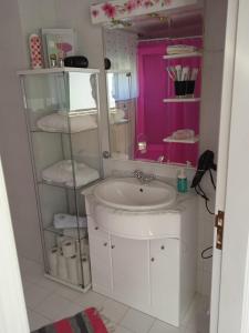 a bathroom with a sink and a mirror at Casa da Ribeira em Rabal in Rabal