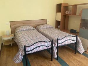 Postel nebo postele na pokoji v ubytování All’angolo