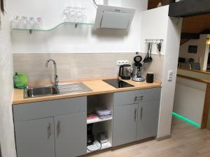 a kitchen with a sink and a counter top at Felsenblick in Rodalben