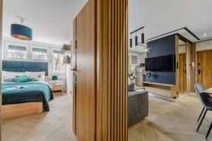 Posteľ alebo postele v izbe v ubytovaní P&O Apartments Sobieskiego - Mokotów