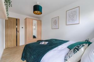 Posteľ alebo postele v izbe v ubytovaní P&O Apartments Sobieskiego - Mokotów