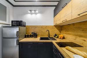 Kuchyňa alebo kuchynka v ubytovaní P&O Apartments Sobieskiego - Mokotów