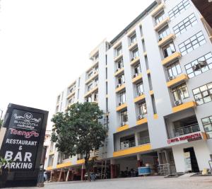 a bar sign in front of a building at HOTEL BRAHMAPUTRA MADHUKALYA in Guwahati