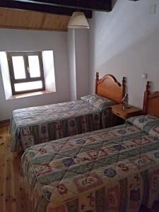 Postel nebo postele na pokoji v ubytování Casa Lovaco (Borau)