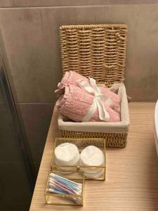 a wooden table with a basket and a box of towels at Dream home Serres romantic living in Serres
