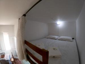 Cama ou camas em um quarto em Apartamento Cabo Frio