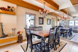 a dining room and living room with a table and chairs at 2 Br With Open Floor Plan & Updated Kitchen Condo in Crested Butte