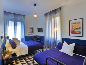 Postel nebo postele na pokoji v ubytování Nuccia Urban Loft