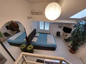 an overhead view of a bedroom with two beds at Sweet Apartments and Rooms in Niš