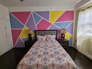 Ένα ή περισσότερα κρεβάτια σε δωμάτιο στο Tropical Suites