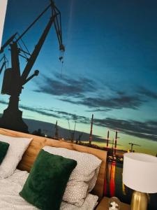 a balcony with a view of a crane at Gold Box Apartament in Gdańsk