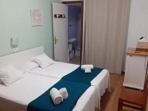 Posteľ alebo postele v izbe v ubytovaní Portal 17 Can Tort