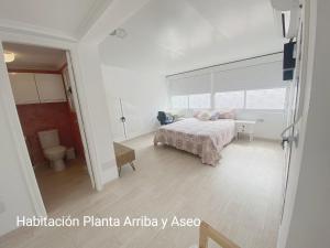 A bed or beds in a room at Bungalow soleado a 100 metros de La Playa