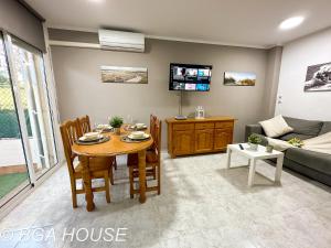 a living room with a table and a couch at Bga Rentals Aini in Cambrils