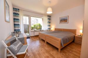 Postel nebo postele na pokoji v ubytování Haus "Luv und Lee" Appartement LUV29 + 14 fotografií