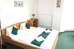Postel nebo postele na pokoji v ubytování Hotel Central