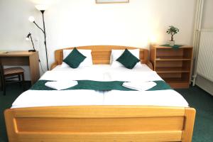 Postel nebo postele na pokoji v ubytování Hotel Central