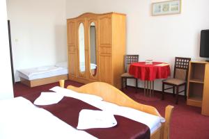 Postel nebo postele na pokoji v ubytování Hotel Central