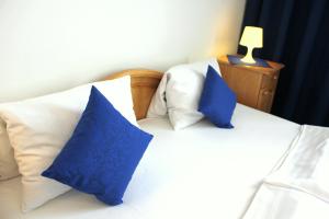Postel nebo postele na pokoji v ubytování Hotel Central
