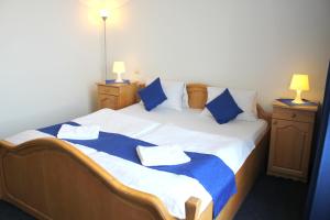 Postel nebo postele na pokoji v ubytování Hotel Central