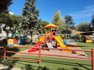 a playground with a slide in a park at Ricomincio da Polignano in Polignano a Mare