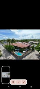a picture of a view of a house with a pool at Pousada Barra Sol in Barra de São Miguel +19 photos