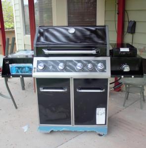 a barbecue grill with a stove in a garage at Amazing 4 Bedroom House with nice Backyard in Littleton