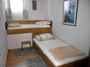 Postel nebo postele na pokoji v ubytování Apartments Villa Marija