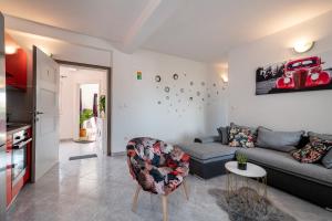 a living room with a couch and a car on the wall at Holiday Villa Nostra in Trogir